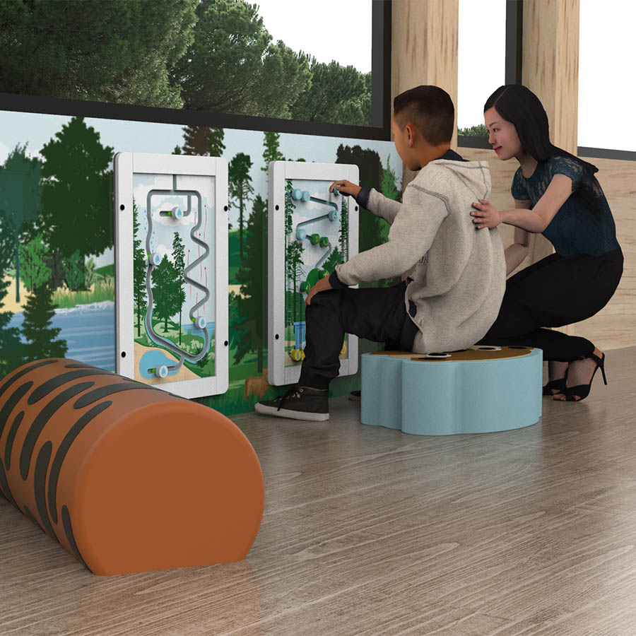 This image shows a boy playing with a educational wall game