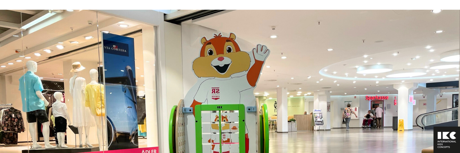 Interactive children's play panel with animal figure and number mat in a shopping mall
